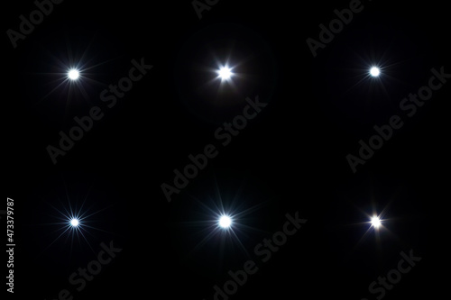 Obraz na płótnie Set of flash lights with lens flare effect on black background w salonie