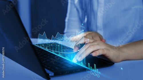 Stock market investment. Business person analysing economic growth graph financial data on laptop.. Business strategy and digital marketing concept.Financial and banking Technology.