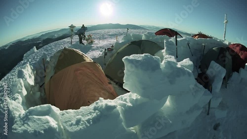At the highest peak of Ukraine Goverla stands on New Year camp climbers romantic Ukrainian country. Extreme tent buried in snow storms withstand bad weather and frost wind Chernogora