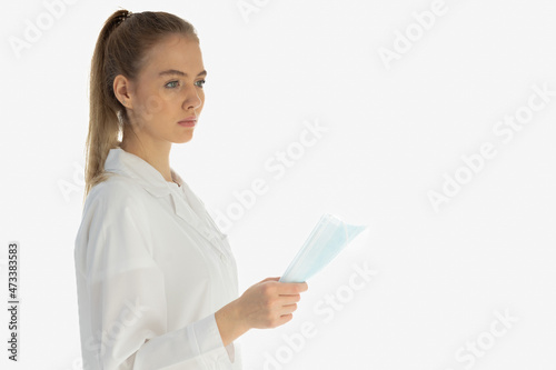 Covid19, coronavirus, healthcare and doctors concept. Portrait of optimistic russian female doctor assure everything be okay, wear medical mask to prevent catching virus, white coat.