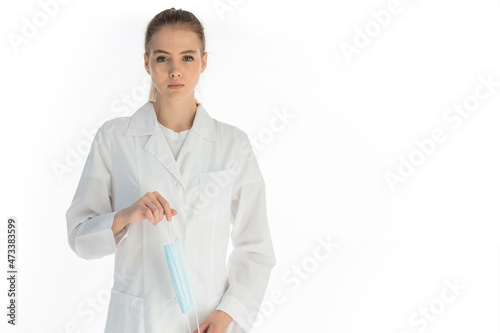 Covid19, coronavirus, healthcare and doctors concept. Portrait of optimistic russian female doctor assure everything be okay, wear medical mask to prevent catching virus, white coat.