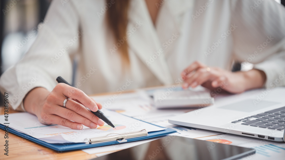 business woman work in the business office on the desk business woman work in the business office on the desk