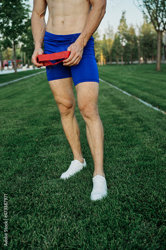 athletic man working out in the park crossfit exercise