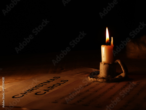 Fotografie Christmas carols music song sheet with candle