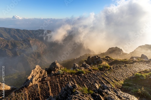 Mountain trail Pico do Arieiro, Madeira Island, Portugal Scenic view of steep and beautiful mountains during sunrise.