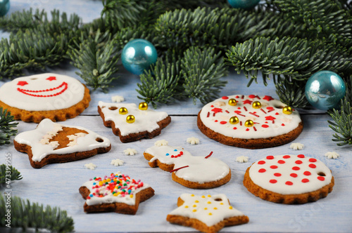 Different Christmas cookies on blue wooden table. Christmas composition.