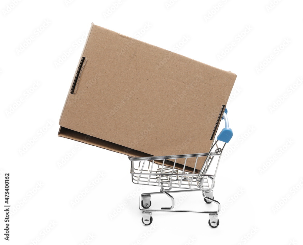 Closed cardboard box on shopping cart isolated on white background