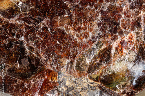 Macro of a mineral stone Vesuvianite on a white background photo
