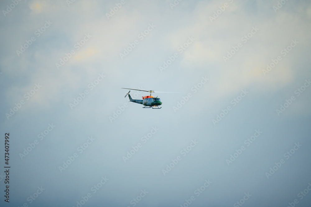Fototapeta premium ZH814 British army (Army Air Corps AAC) 1971 helicopter Bell 212 B-BGMH conducting pilot training Salisbury Plain UK