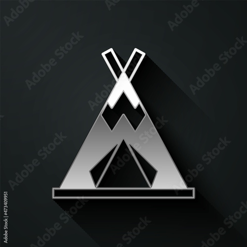 Silver Traditional indian teepee or wigwam icon isolated on black background. Indian tent. Long shadow style. Vector