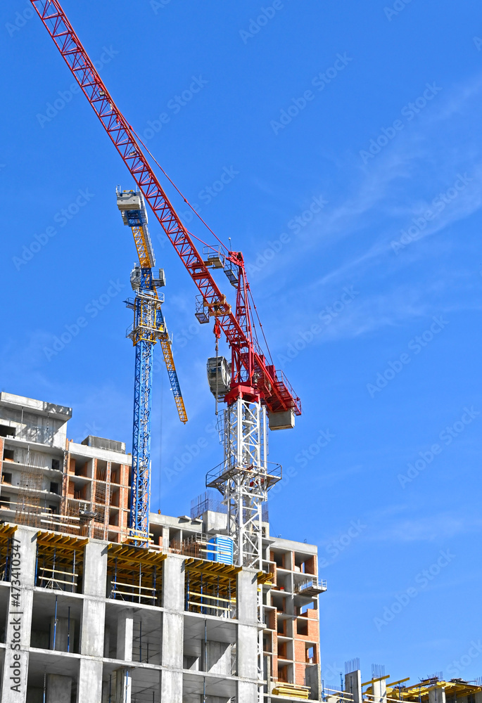 Crane and highrise construction site Crane and highrise construction site