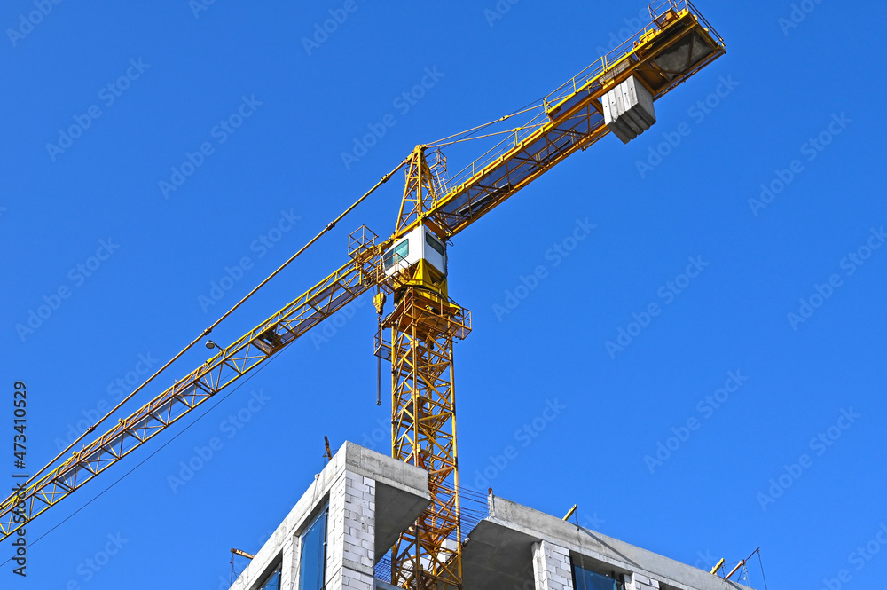 Crane and highrise construction site Crane and highrise construction site