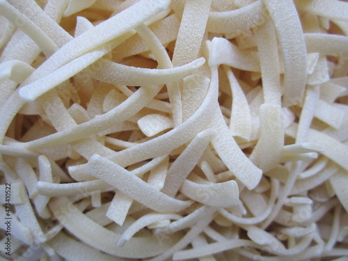 semi-finished products small flat pasta in plastic packaging