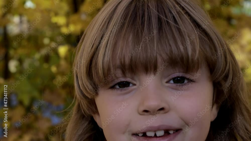 Cute girl of 6 years is approaching the objective. Cute girl of 6 years is approaching the objective.