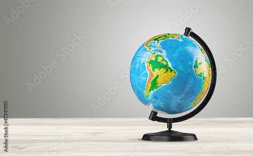 Earth classic globe on a wooden table.