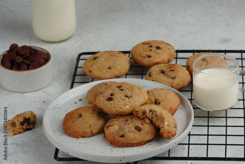 a plate of chocolate chips cookies on white background a plate of chocolate chips cookies on white background