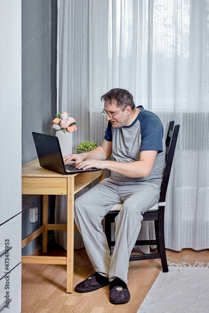 Presbyopia is an age related visual impairment, 52 year old man trying to read text on laptop screen. Presbyopia is an age related visual impairment, 52 year old man trying to read text on laptop screen.