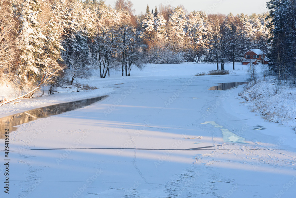 beautiful sunset over the river with snowy trees in winter beautiful sunset over the river with snowy trees in winter