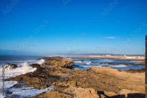 Volcanic coast of the Atlantic ocean at Essaouira, Morocco on a sunny summer day.