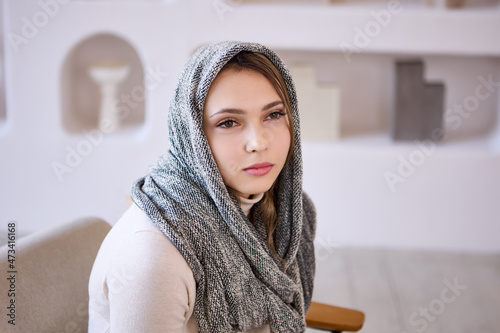 24 year old European woman wears hijab or Christian head covering. photo