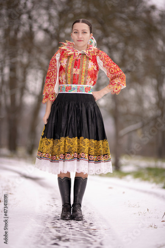 Young beautiful slovak woman in traditional dress. Slovak folklore