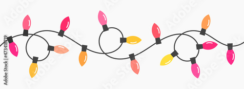 Christmas lights string border isolated on white background.