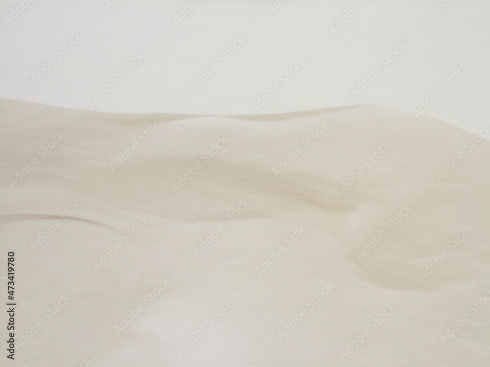 Fototapeta premium Shadows and patterns on the surface of snow