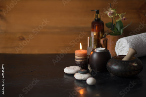Wooden background with candles in the SPA care area