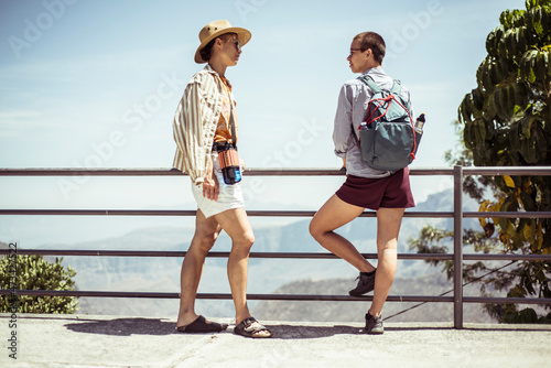 Summer female friend tourists chat with view of Mexican cannyon photo