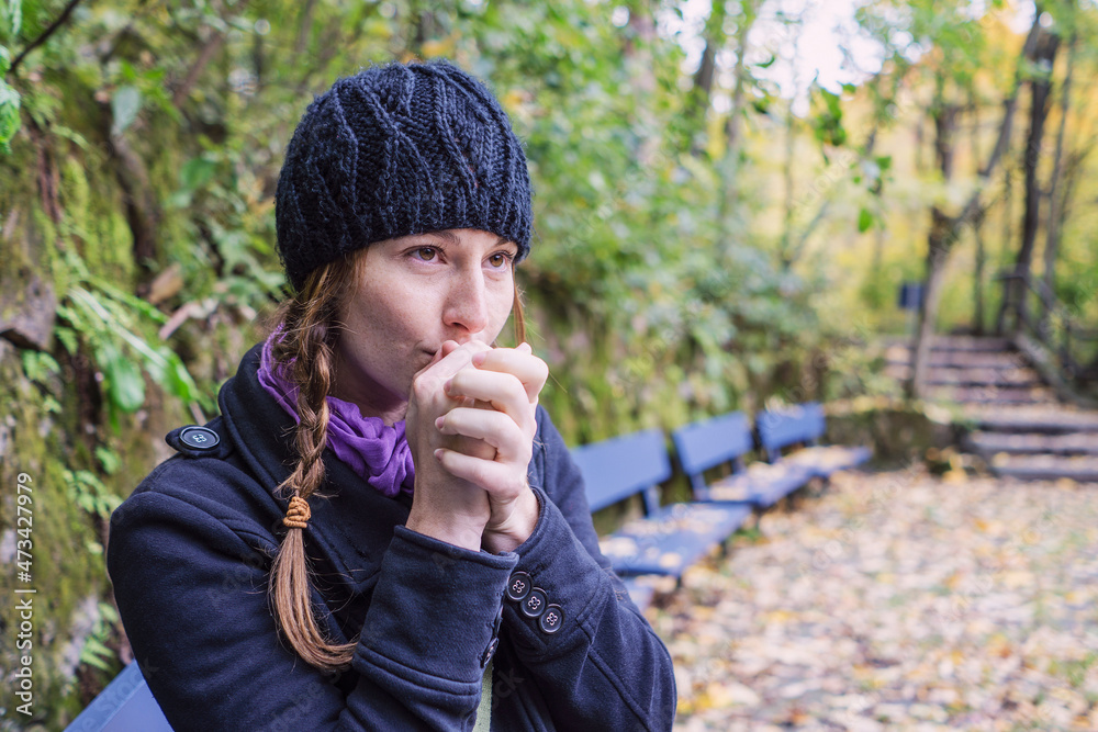 Solo woman traveller exploring park during autumn Solo woman traveller exploring park during autumn