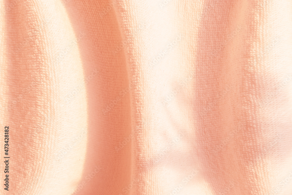 Fototapeta premium Abstract background, pink fabric with a curved texture and natural gradation of shadows.for graphic design ,spacefor text