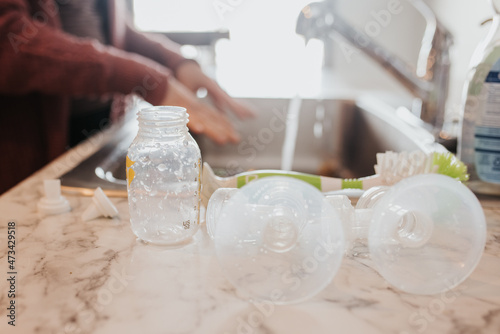 Bottle and pumping parts laying out to dry in the kitchen