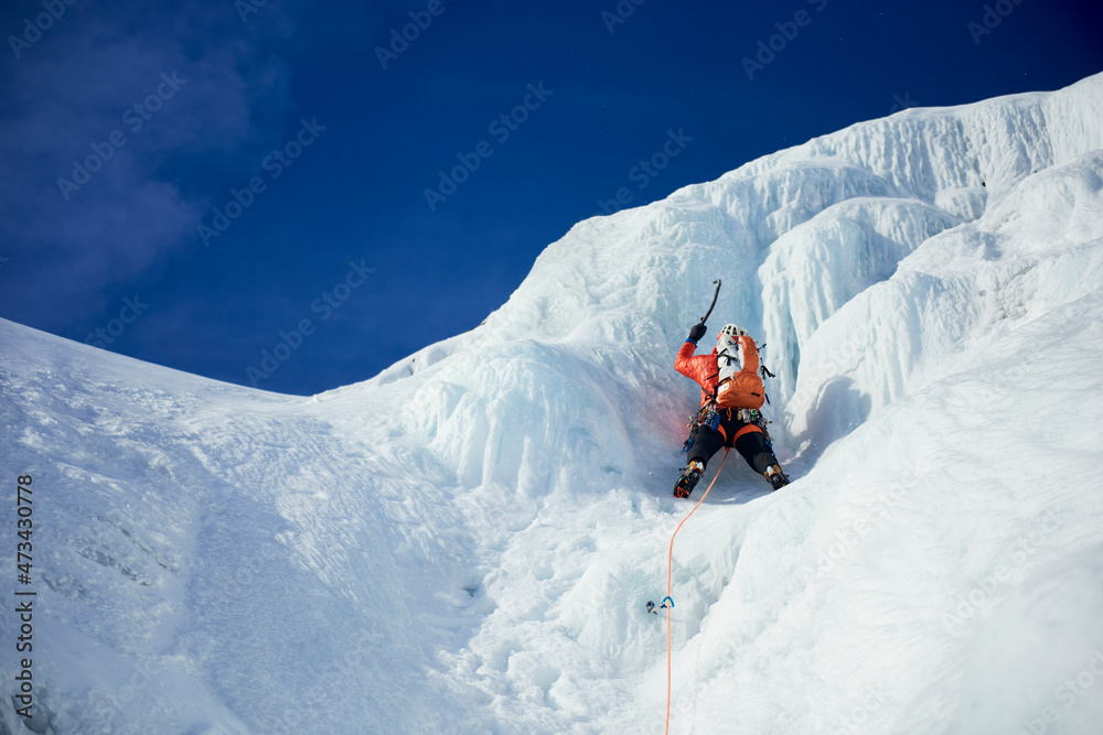 Male Ice climbing guide leading an ice climb in New Hampshire Male Ice climbing guide leading an ice climb in New Hampshire