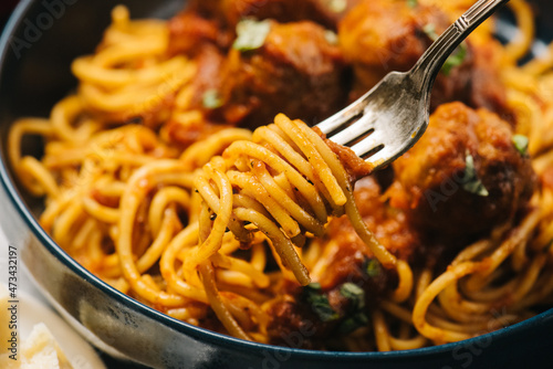 Spaghetti spun onto a fork closeup
