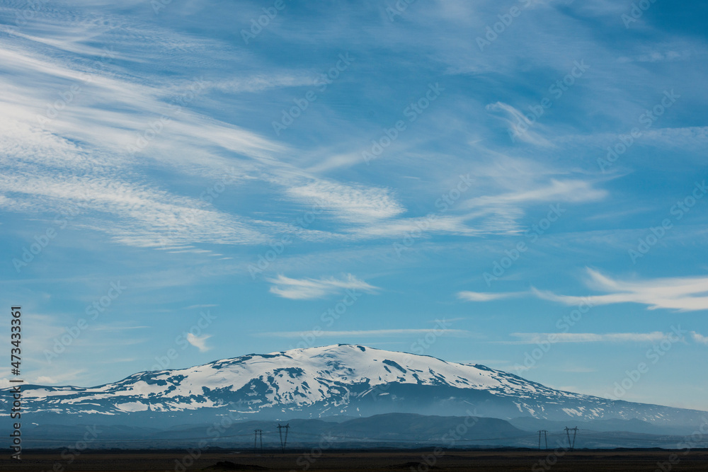 powerlines in front of the active volcano Hekla in south Iceland powerlines in front of the active volcano Hekla in south Iceland