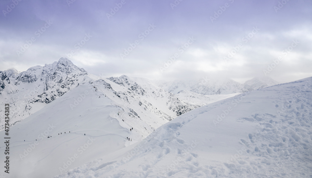 Snow mountains with low white clouds . Zakopane, Poland Snow mountains with low white clouds . Zakopane, Poland