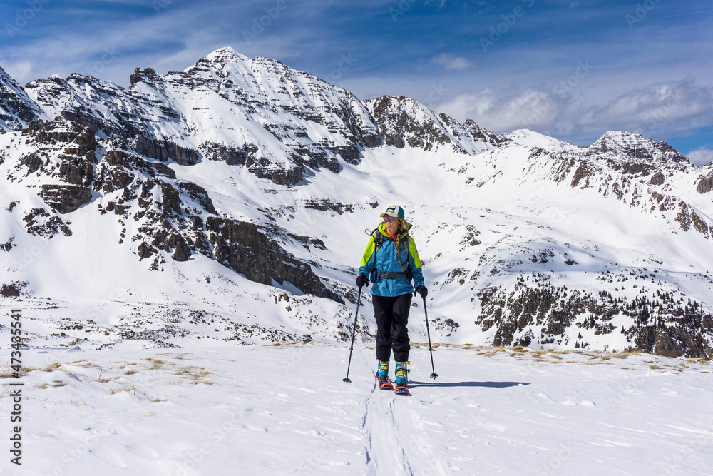 Young female ski touring in high mountains of Colorado Young female ski touring in high mountains of Colorado