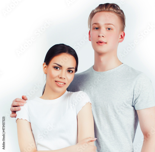 modern hipster guys together couple diverse nations, asian girl and caucasian blond boy isolated on white background, lifestyle people concept photo