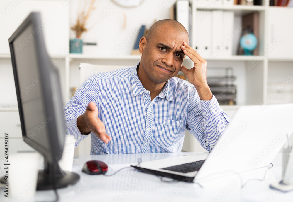 Fototapeta premium Tired businessman working with documents in office at the table