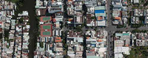 Aerial map panorama of Phu My Hung district of Ho Chi Minh City, Vietnam featuring canal and tennis courts on sunny clear day