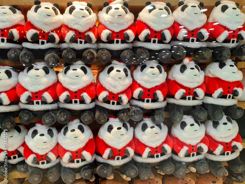 cute and funny panda in Santa Claus clothes Cute and funny kids toys on shelf in store © bmarya83