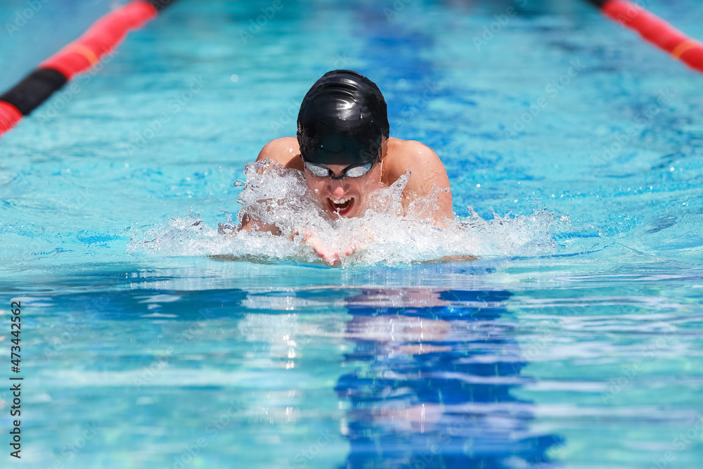 Breaststroke swimmer in a race