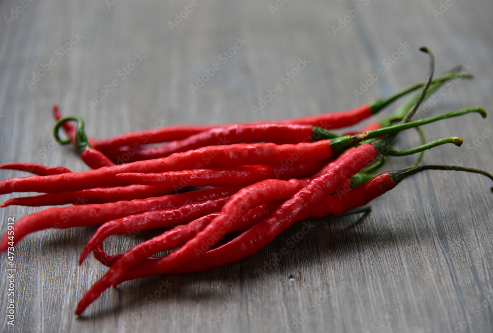 Red Chili Curly, is classified as either a vegetable or a condiment, depending on how it is used. As a condiment, spicy chilies are very popular in Indonesia as a food flavor enhancer