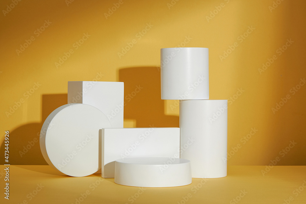 Yellow background with circle , square white podium and blank space for advertising , abstract content , front view Yellow background with circle , square white podium and blank space for advertising , abstract content , front view