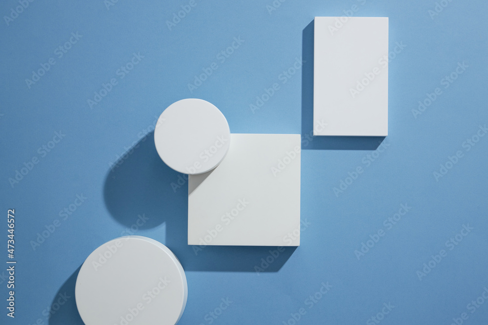 Top view of blue background with square and circle podium blank space for product advertising abstract content Top view of blue background with square and circle podium blank space for product advertising abstract content