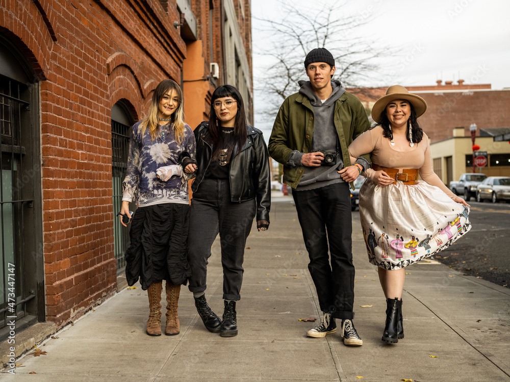 Young Indigenous friends walking outdoors Young Indigenous friends walking outdoors