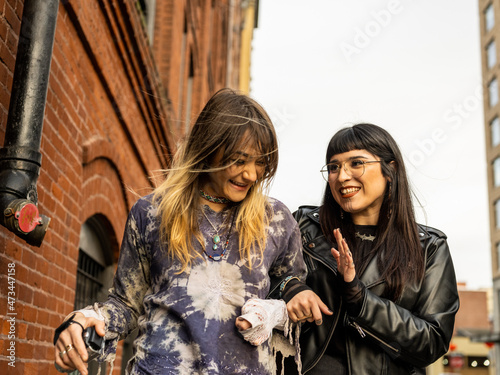 Young Indigenous friends walking outdoors