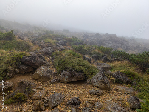 Rocky rugged mountain trail in a fog (Zao, Yamagata, Japan)