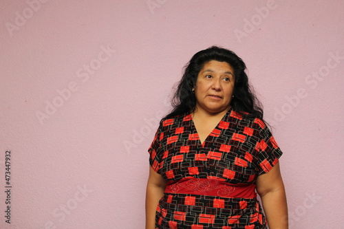Body positive overweight fat latin adult woman shows her dislike, anger and annoyance that something is not right
