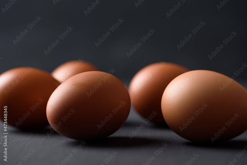 Fresh organic chicken eggs on black background Fresh organic chicken eggs on black background